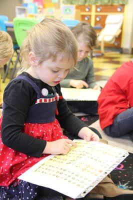 Little Blessings preschooler learning to read