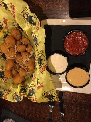 Cheese curds, served with three dipping sauces