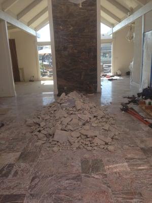 Tearing out tile to lay down a beautifully Italian tile that looks like wood!