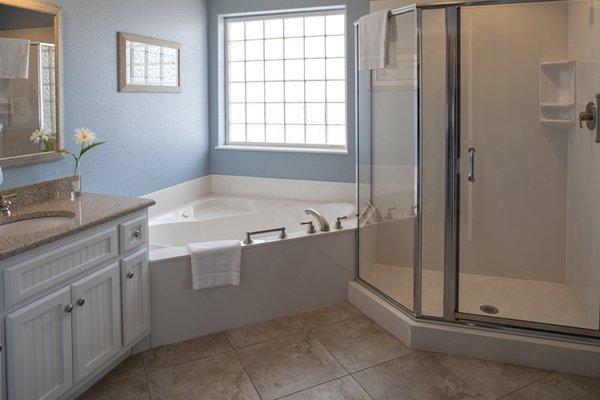 Walk-in shower and tub for 1-bedroom unit.