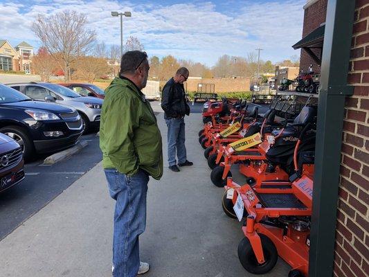 Checking out the deals on zero-turn mowers.