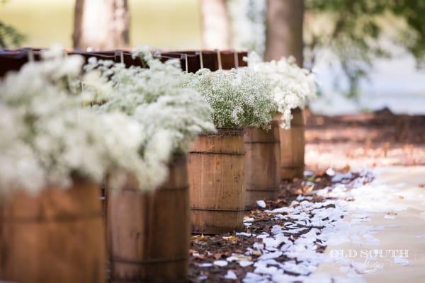 Rustic wedding decor small nail kegs or barrels.