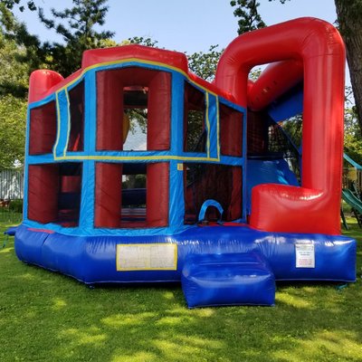 Combo bounce house with slide, basketball hoop and obstacles