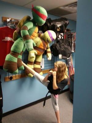 Tokyo Joe's is very animated! Pictured here is one of our Junior Black Belts.  Kicking develops balance, focus, speed and power.