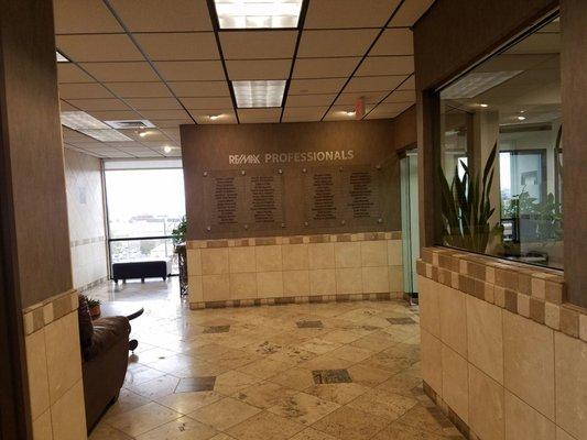 Front lobby with wall directory of agents...