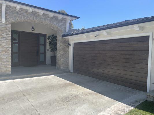 Entry Door and Garage Door combo. Stained and sealed. They look great!