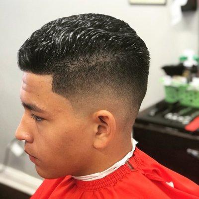 Classic low taper with a scissors cut combover.