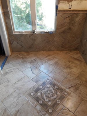 Owner gave our tile guy creative freedom on 3 bathrooms. He did the following...