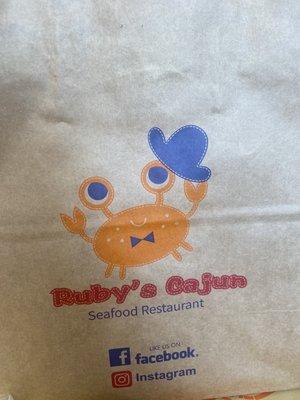 Ruby's Cajun bag to put your food in. I thought it was cute Mr. Crab.