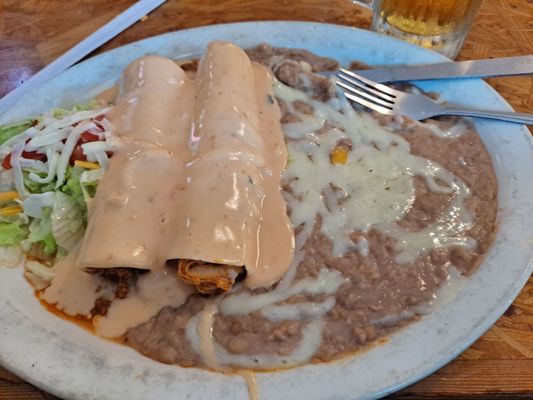 Enchiladas with queso and refried beans