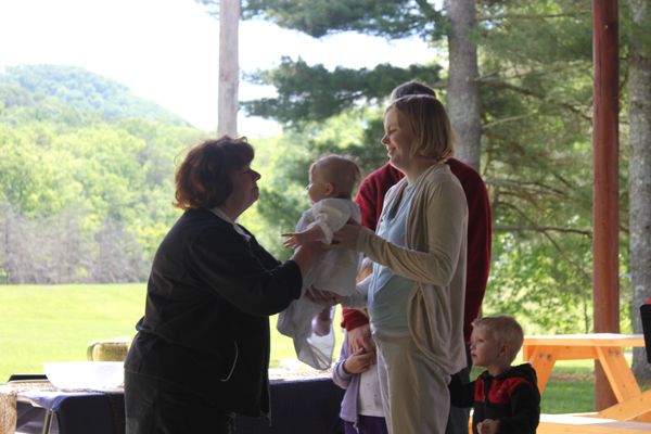 Baptism at the annual worship service at our Presbyterian camp-- Camp Burnamwood