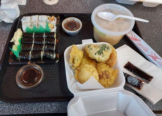 Two avocado rolls, one peanut and avocado roll, vegetable tempura, and miso soup.