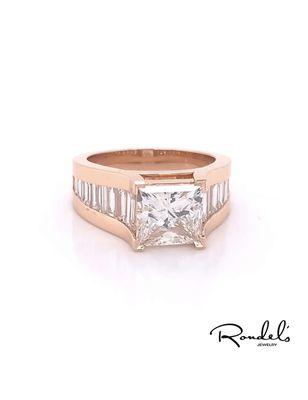 custom made 4.00 Princess cut diamond with 2.00 baguettes along the sides set beautifully in rose gold.