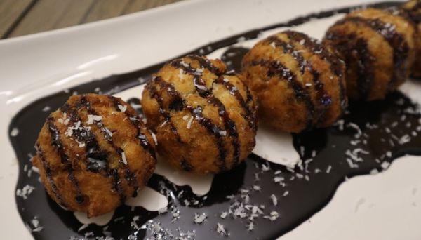 Coco-Dough with chocolate icing and extra coconut flakes.