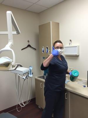 Lisa wiping down her room after her patient.