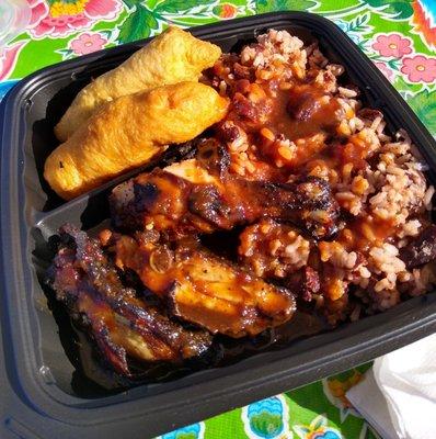 Jerk chicken plate with rice & peas and festival