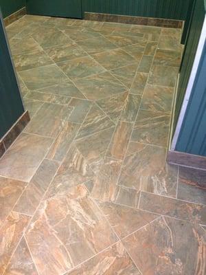 installing new floor tile at building lobby