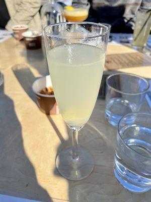 French 75 (earl grey tea flavored gin, fresh squeezed lemon juice, simple syrup, Prosecco). Not bad. The juniper was strong!