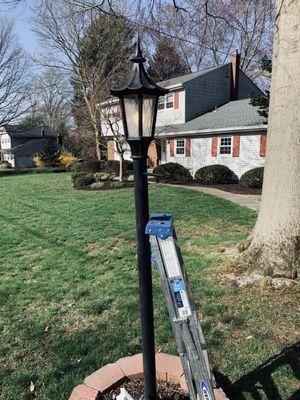 Repaired lantern in front of home