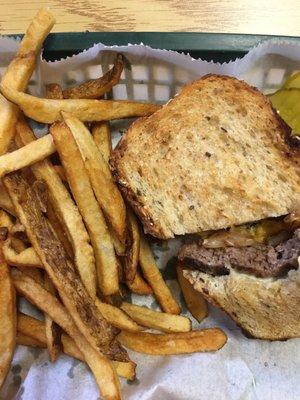 Patty Melt with American, Swiss cheese, grilled onions on grilled hearty bread. Hand cut fresh French fries.