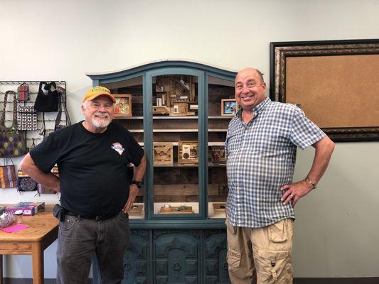 Mark and Charlie admiring Mark's crafts.