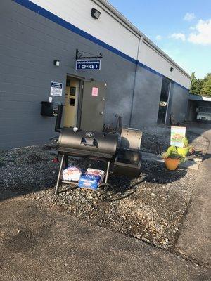 Outside waiting area with a grill. Come on by.