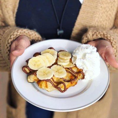 Liege waffle with bananas, Nutella and whipped cream