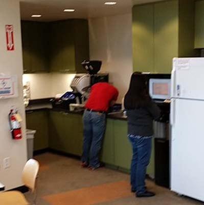 Our technician on site repairing customers espresso machine.