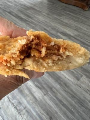 The inside of my tamale. Juicy shredded mild pork inside (wish there were more); a bit crumbly masa outside.