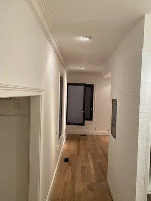 We painted ceilings, crown molding, walls and baseboard.... professional look throughout!!! Check out the shiplap to your right... Nice!!