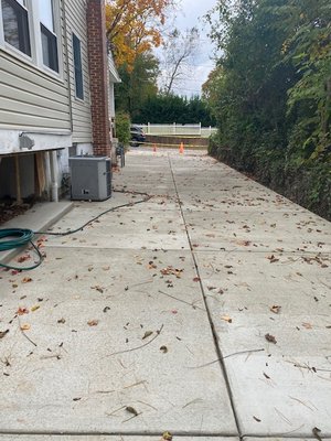 New (extended and level) concrete driveway.