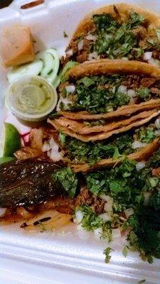 My husband got all Carne Asada! The veggies are cucumber &  radish slices, then grilled onions with grilled Chile relleno. Limes.