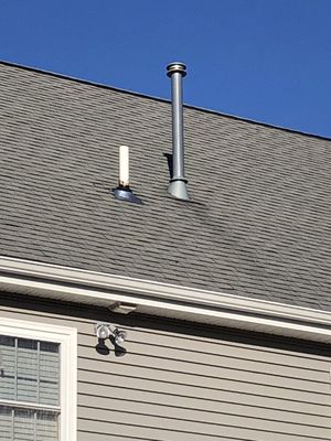 New pipe flashing installed on this roof will postpone a new roof for a few years.