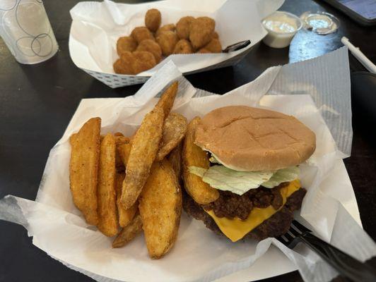 Cheeseburger with chili, potato wedges, and fried mushrooms