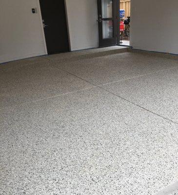 A new large flake epoxy floor installation just completed.