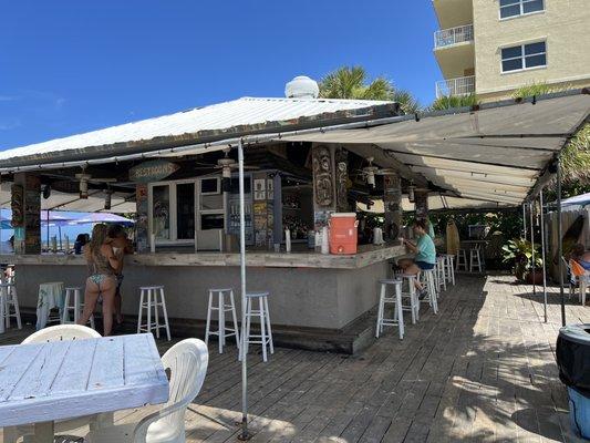 Tiki bar but it's usually has more ppl.  It's early now