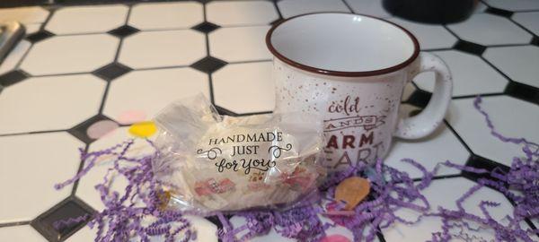 The handmade cocoa bomb and mug