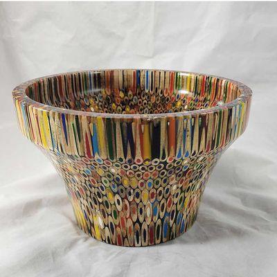 Colored pencil bowl made with 84 dozen-colored pencils and epoxy.