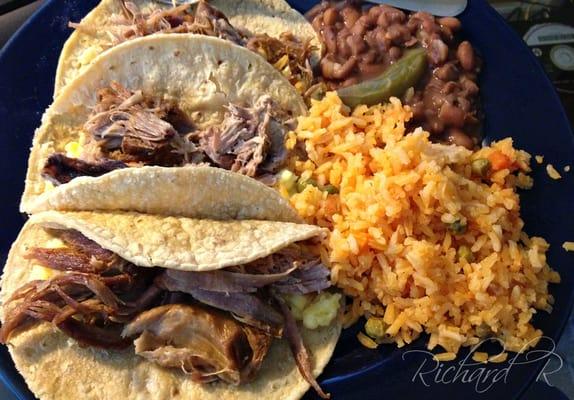 My plate after taking home a half pound of BBQ pork, rice and beans.