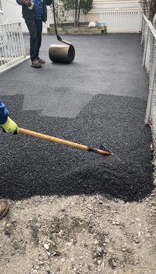 Raking rolling and leveling Asphalt