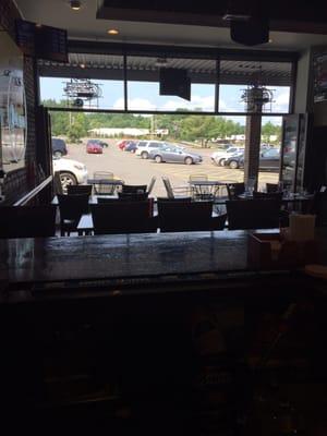 View from bar of open doors to outside tables