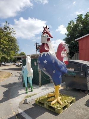 Fun chicken statue wearing a mask!