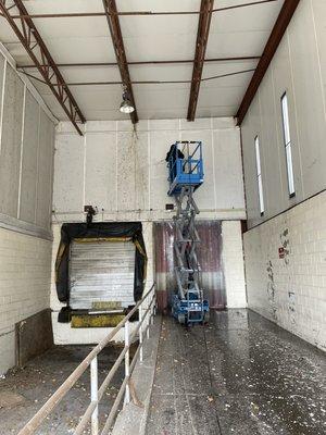 Pressure washing trucking bays at this commercial job.