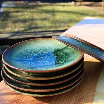 A stack of plates ready to be used at a family dinner.