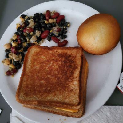 Bean salad, grilled cheese and a roll.