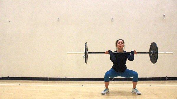 Working on her front squats. A good form correction here is to bring the elbows together and up.