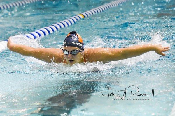 2018 Powers Catholic High School senior, Riley, during a swim meet.  Yes, I do action shots on location!