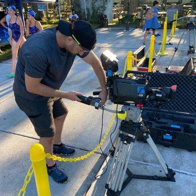 Producer Justin Stark films the Staten Island Interclub Swim Meet at Hillside Swim Club.