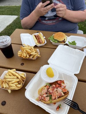 Lobster roll hot with butter, fries, double shack burger, hot dog.