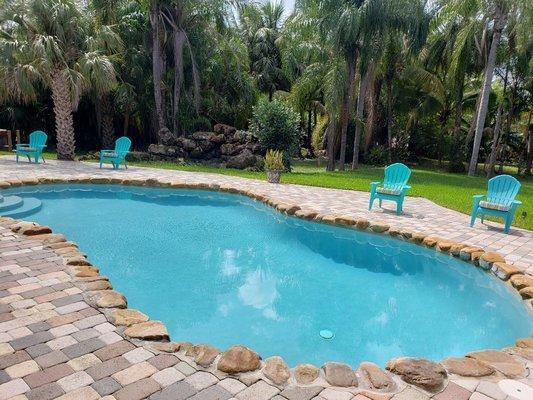 Beautiful salt water pool heated by solar in Parkland.